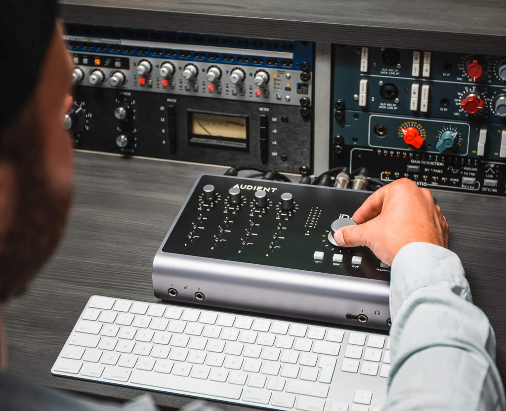 Audient iD44 MK2 audio interface with multiple input and output ports, sleek black design, and professional audio equipment features