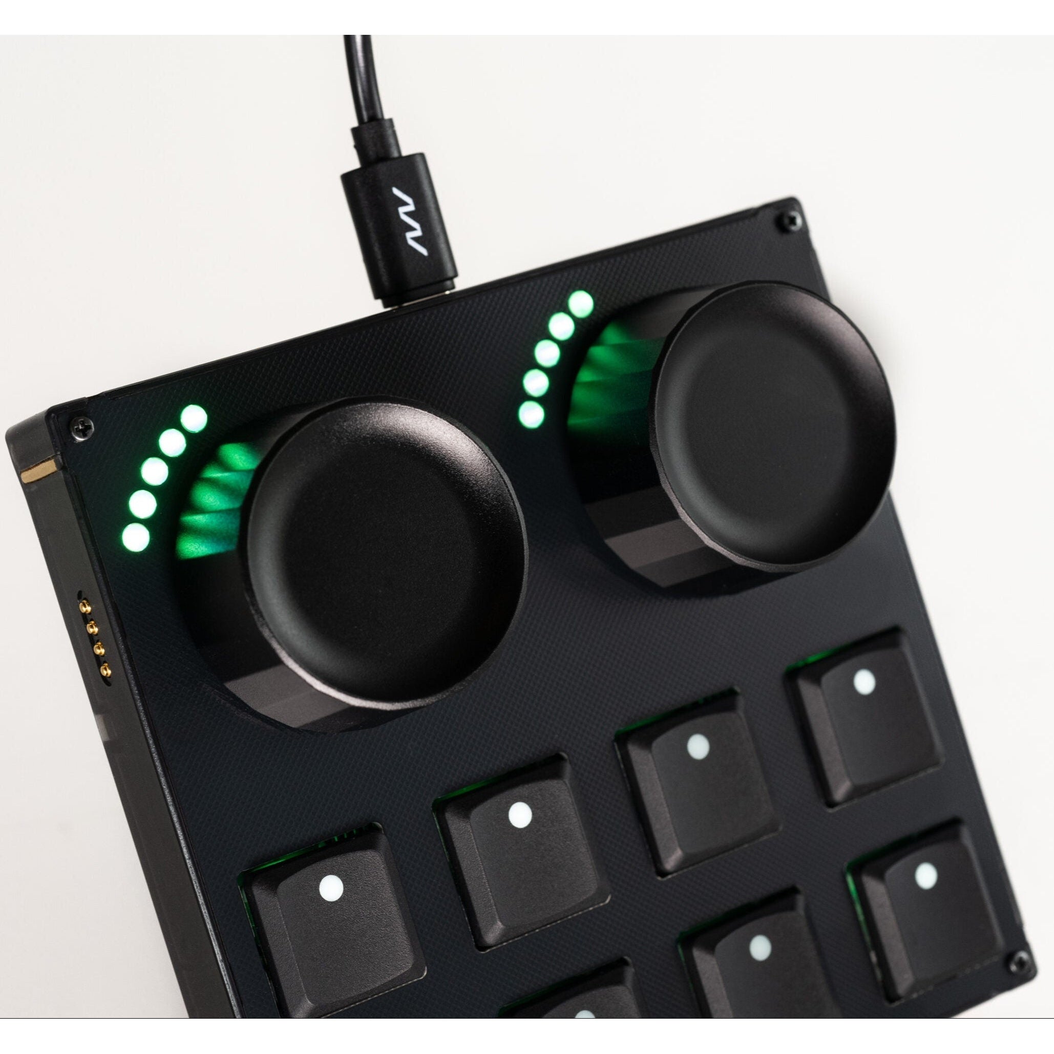 Intech Studio TEK2 Mechanical Series 3 MIDI controller with multiple black keys and control knobs on a sleek surface.