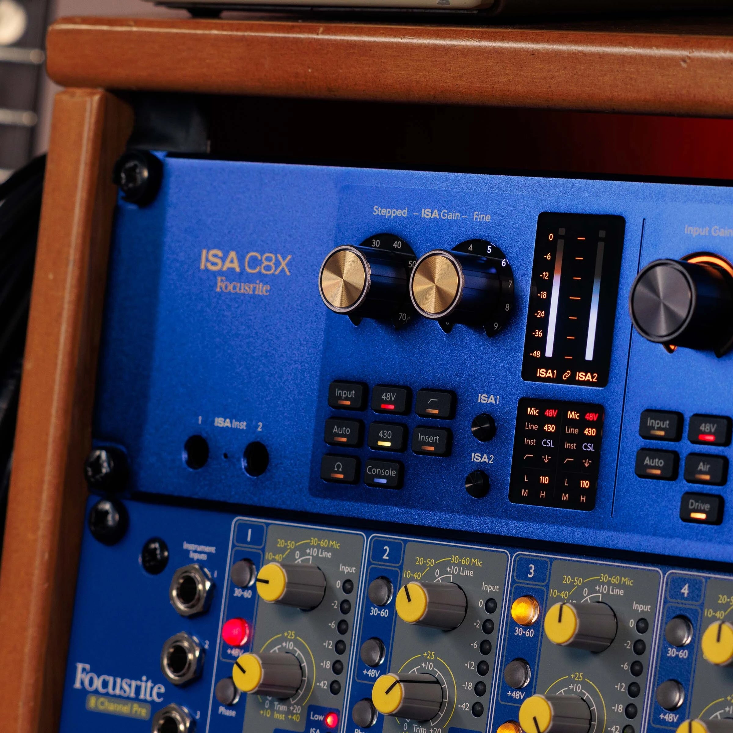 Focusrite ISA C8X USB audio interface with dual preamps and vintage-inspired design, shown in a professional studio setting.