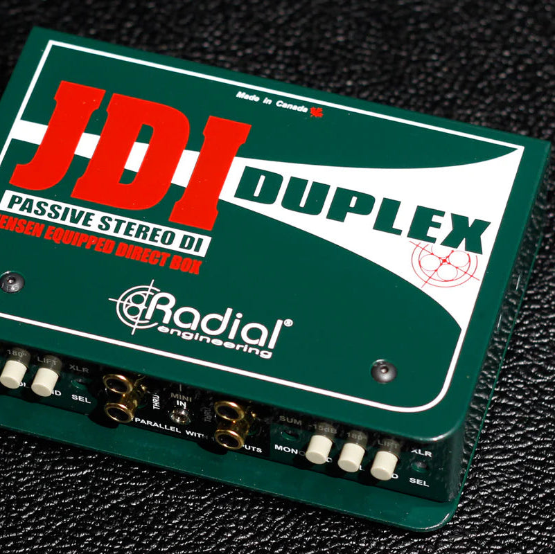 Radial Engineering JDI Duplex DI box with robust metal casing and input/output jacks for professional audio signal conversion.