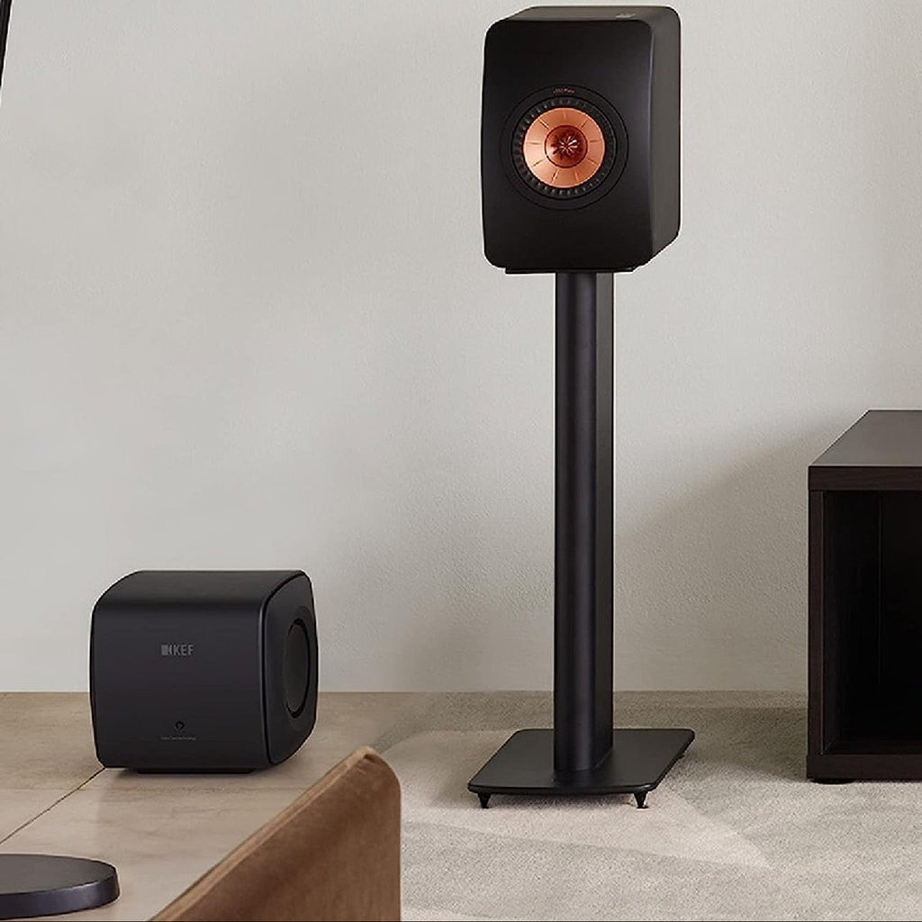 KEF KC62 subwoofer with sleek black enclosure and compact design, ideal for enhancing bass in home audio systems.