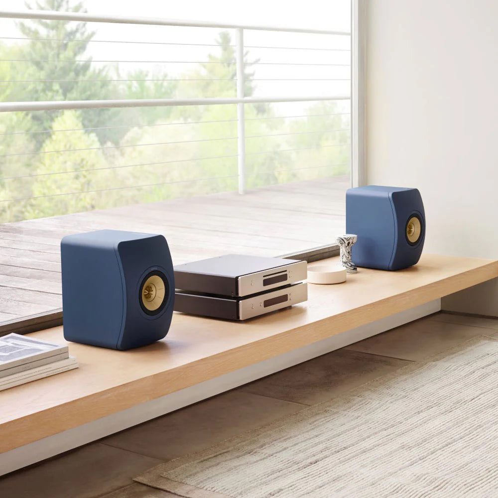 KEF LS50 Meta passive bookshelf speakers with sleek blue finish and modern design, showcasing high-quality audio equipment.