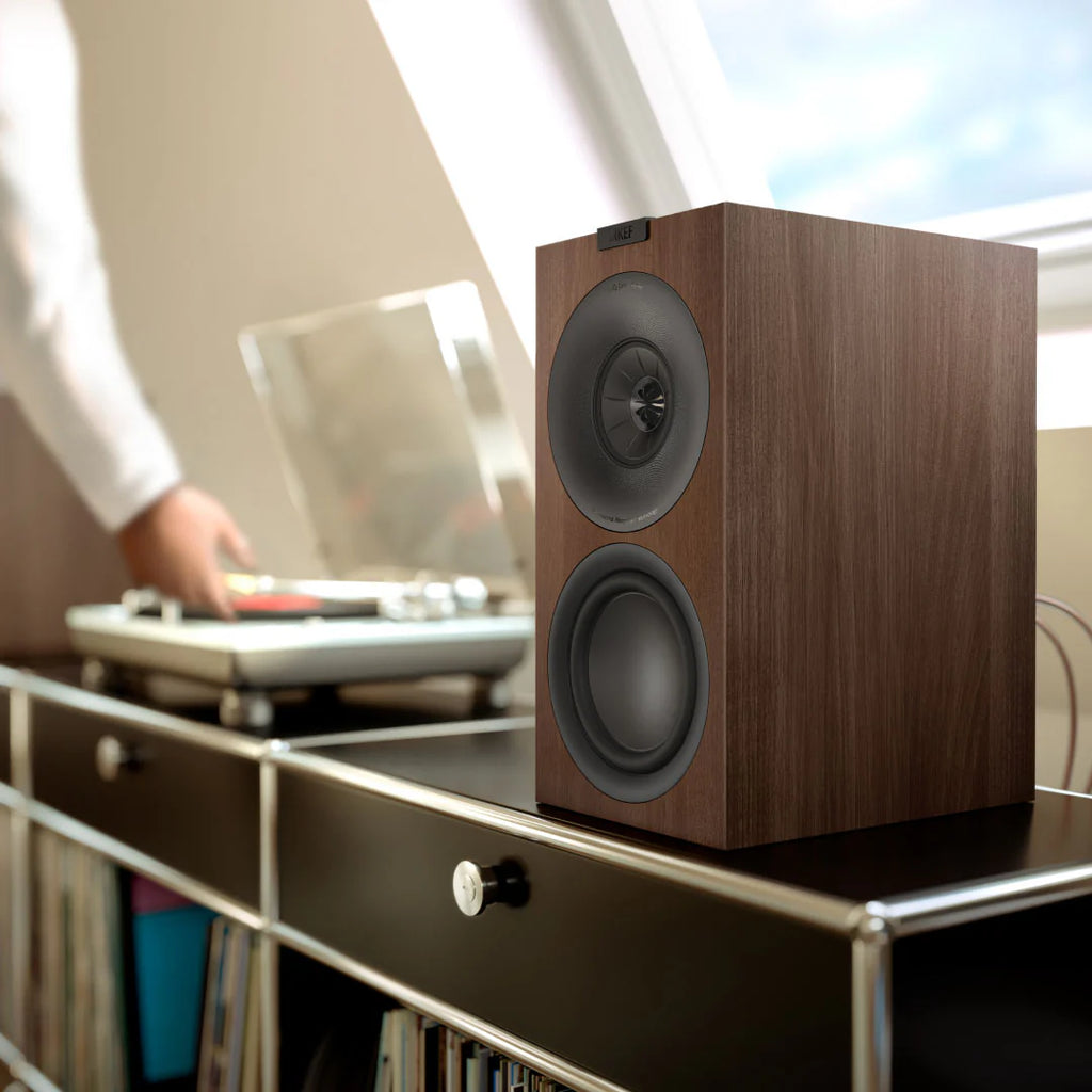 KEF Q1 Meta passive bookshelf speakers shown with sleek black cabinets and detailed drivers for high-quality audio.