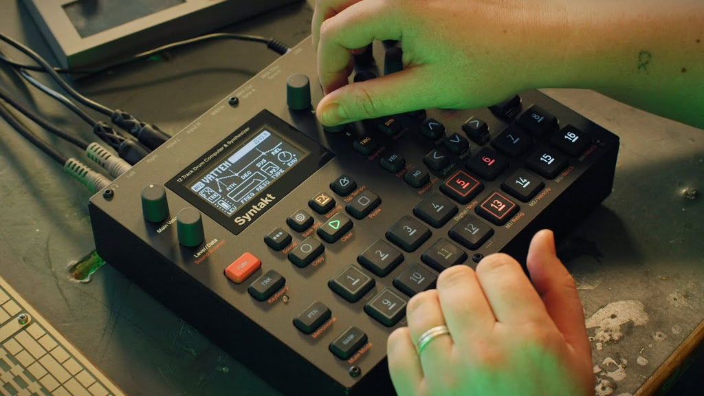 Elektron Syntakt drum machine and sampler with compact electronic interface and colorful knobs and buttons.