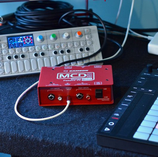 Samson MCD2 Pro DI box with multiple input and output options, compact design, and sturdy build for professional audio setups.