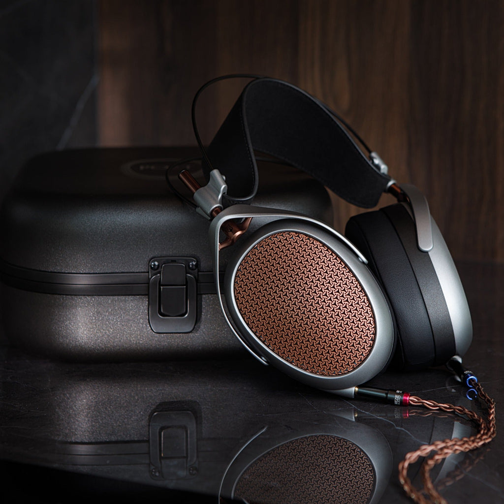 Close-up of Meze Audio Poet wired headphones with sleek design and cushioned ear cups, showcasing high-quality audio craftsmanship.