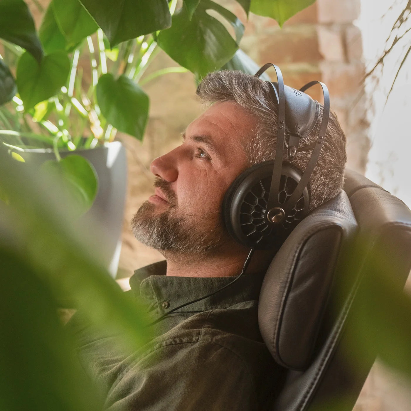 Meze Audio 105 AER wired headphones with sleek design and padded ear cups, shown in a close-up image.