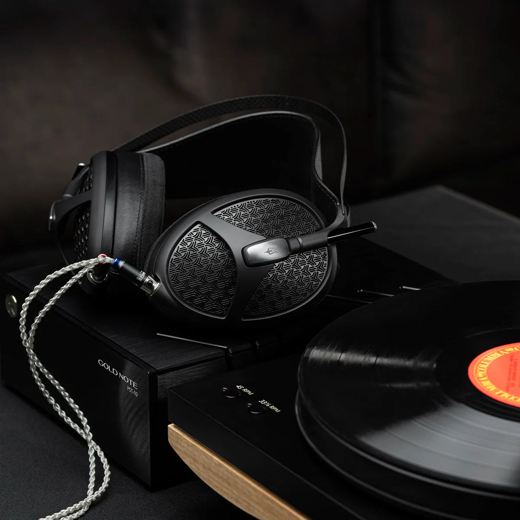 Meze Audio Empyrean II wired headphones with large ear cups and premium black finish, showing detailed ear cushions and headband.
