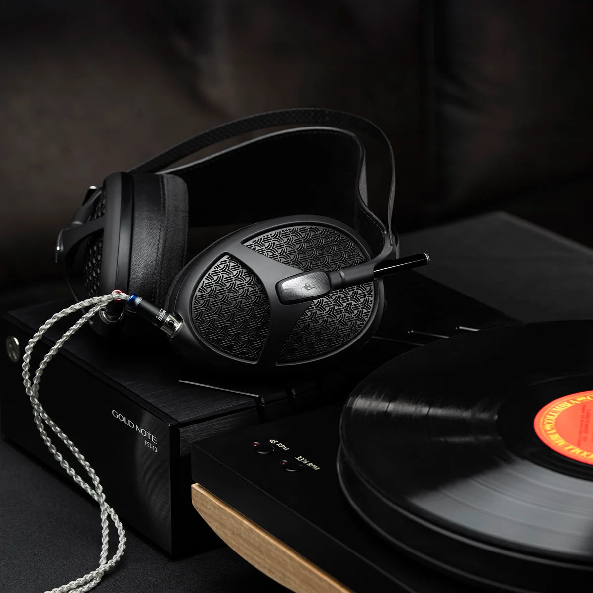 Meze Audio Empyrean II wired headphones with large ear cups and premium black finish, showing detailed ear cushions and headband.