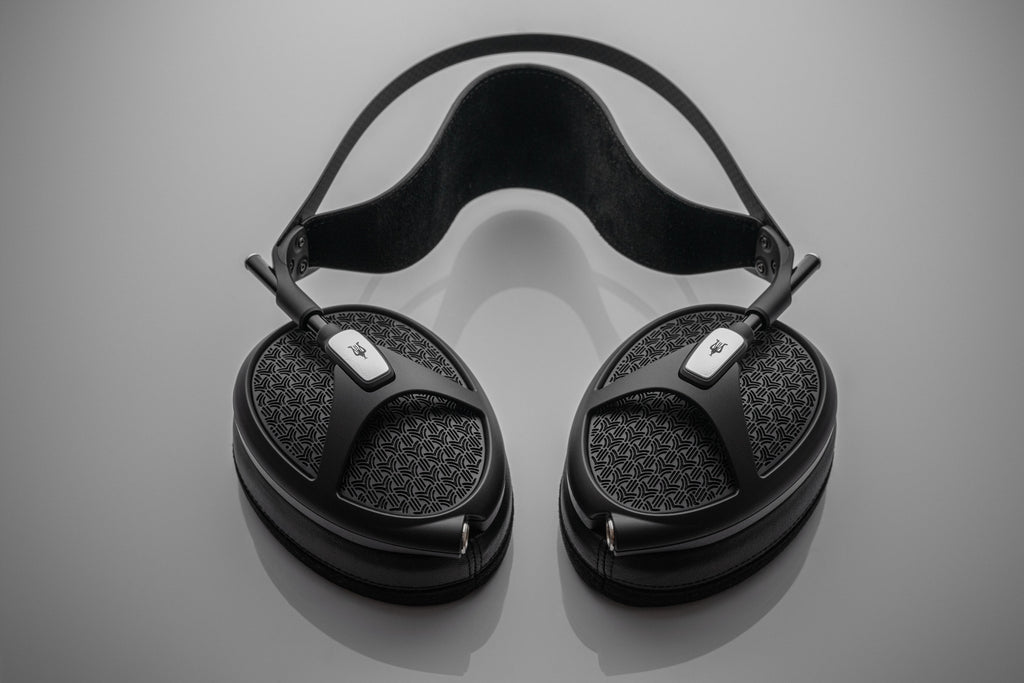Meze Audio Empyrean II wired headphones with open-back design and luxurious ear cups, showcasing premium craftsmanship and audio quality.