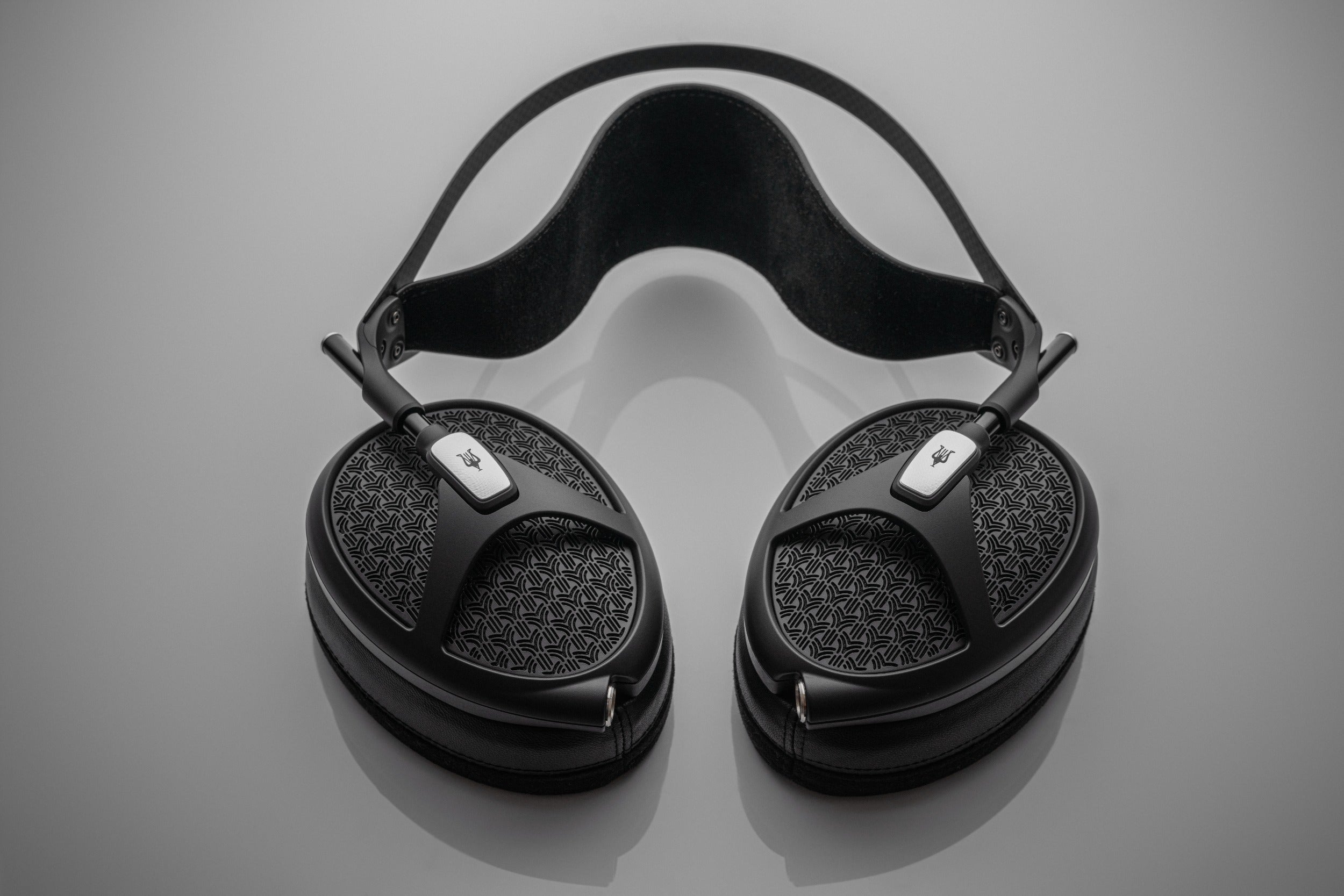 Meze Audio Empyrean II wired headphones with open-back design and luxurious ear cups, showcasing premium craftsmanship and audio quality.