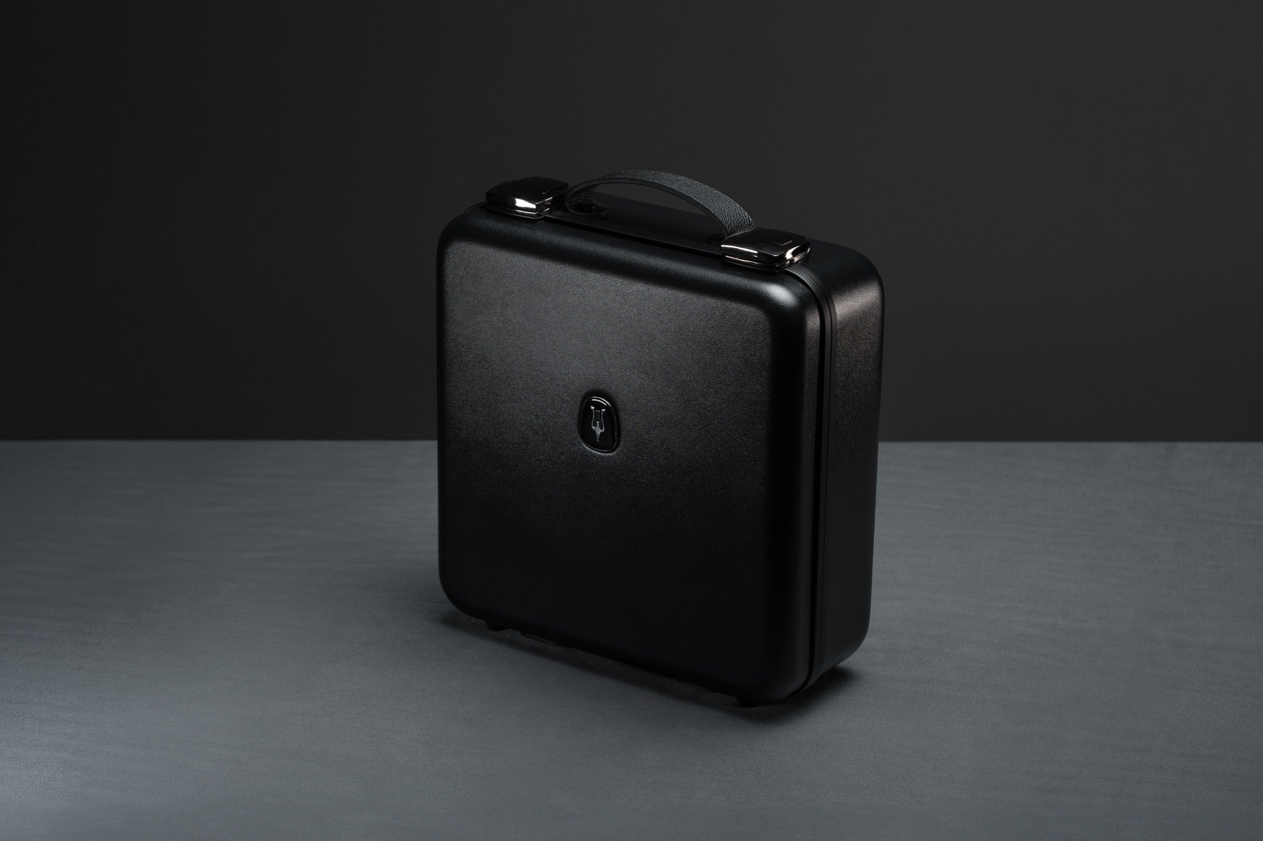 Closed case of Meze Audio Empyrean II wired headphones in a sleek suitcase, showcasing the premium design and high-quality build.