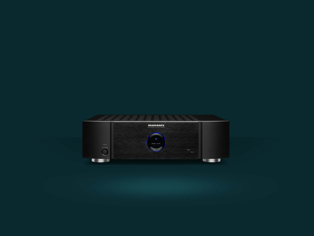 Marantz MM7025 stereo amplifier with dual channels and sleek black design, featuring control knobs and input ports on the front panel.