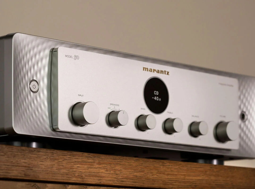 Marantz MODEL 50 stereo amplifier with sleek design and control knobs, displayed in a collage image showing front and side views.