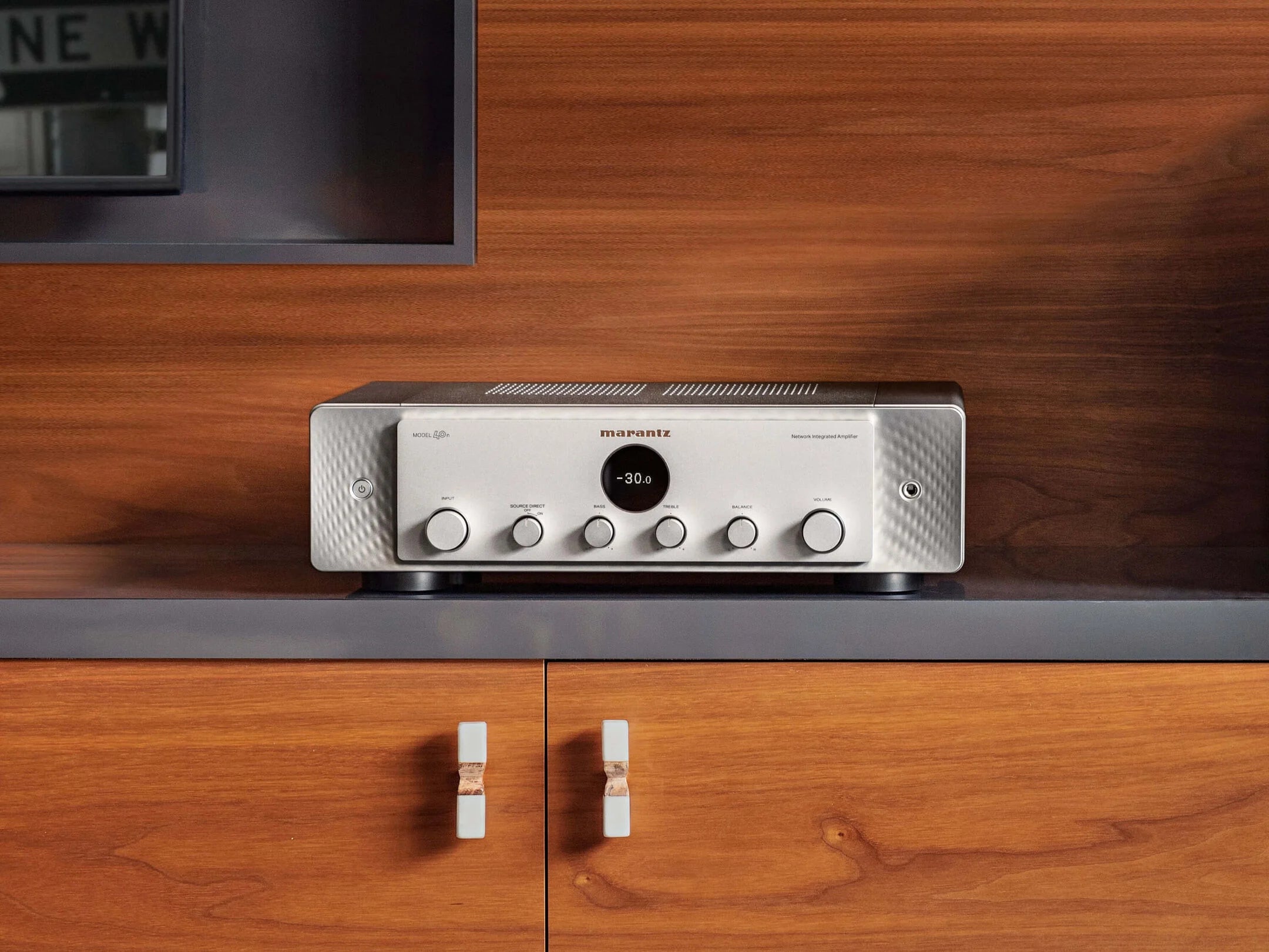 Marantz MODEL 40n silver stereo amplifier with sleek design and digital controls, displayed in a studio setting.