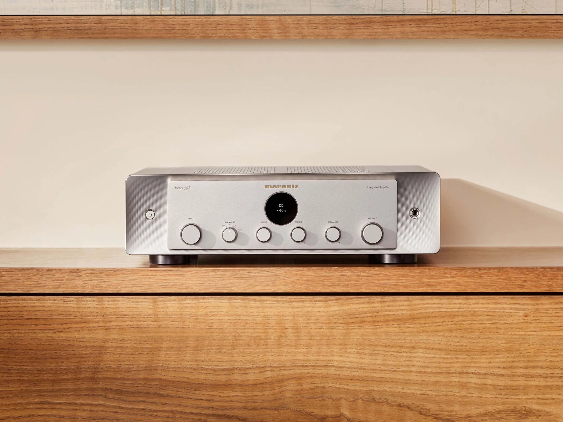 Marantz MODEL 50 stereo amplifier in silver finish, front view showcasing control knobs and display on a studio background.