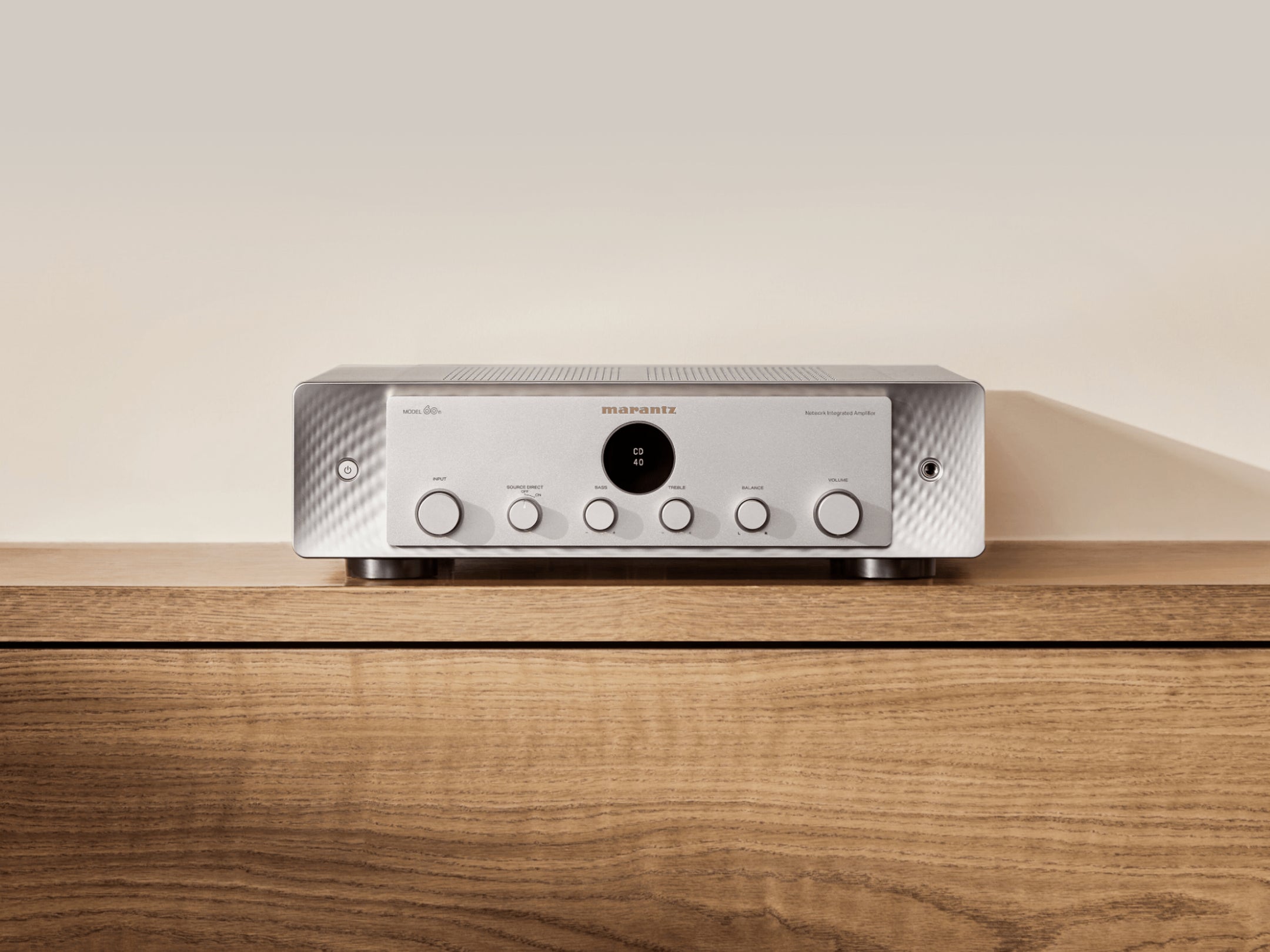 Marantz MODEL 60n stereo amplifier with sleek design and control knobs, showcasing high-quality audio equipment.