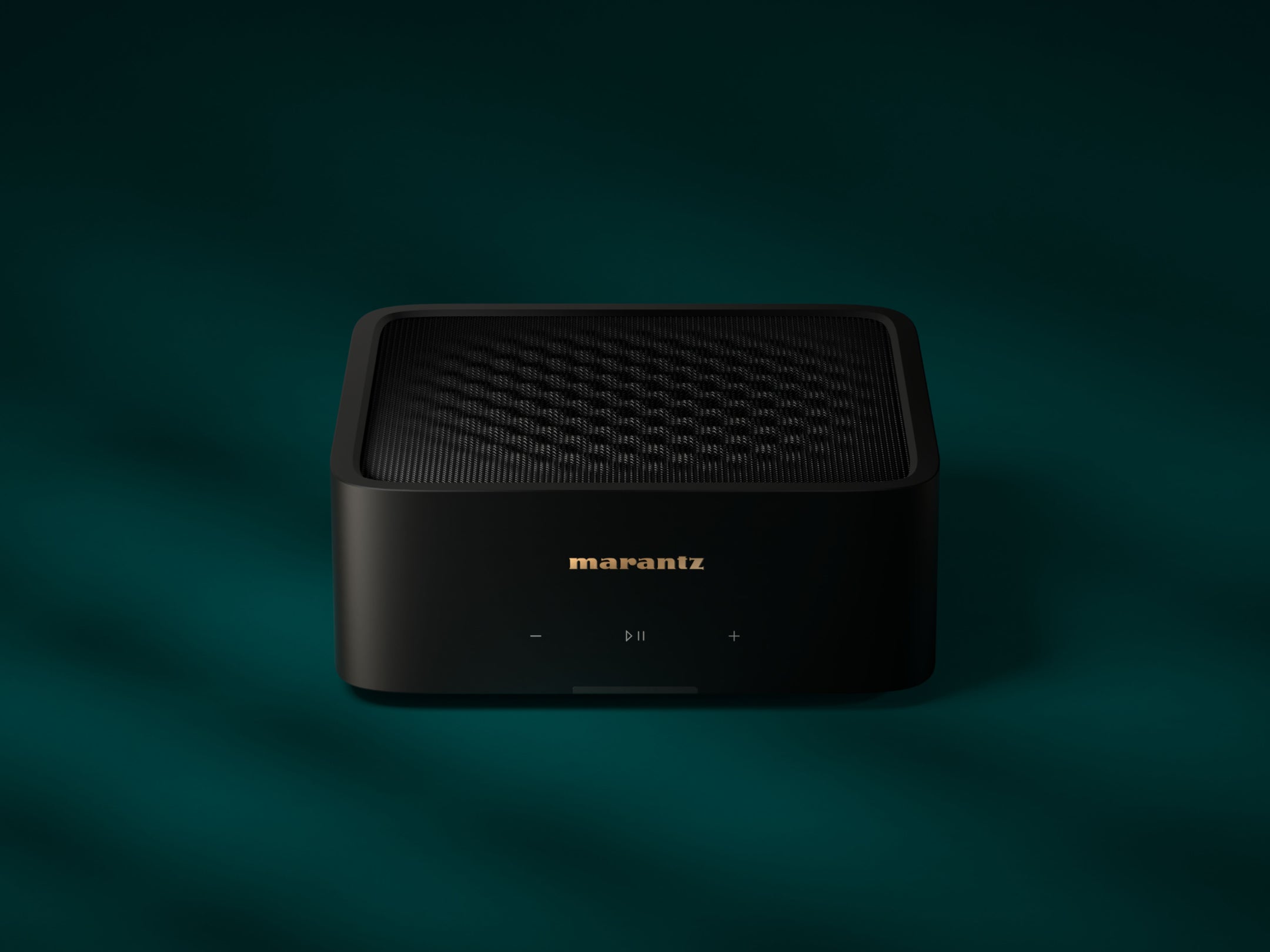 Marantz MODEL M1 music streamer with sleek design, front display, and control buttons for high-quality audio streaming.