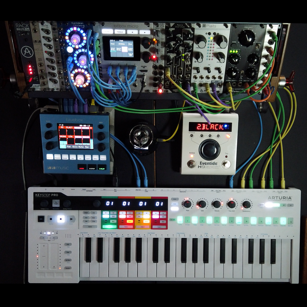 1010music Bluebox digital mixer with modular setup, featuring multiple control knobs and input/output ports in a square layout.