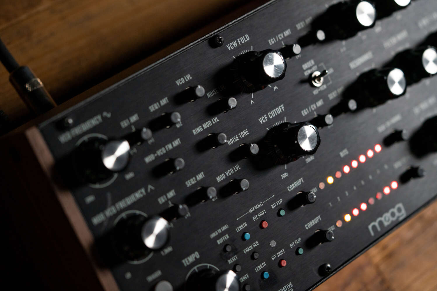 Close-up of Moog Labyrinth synthesizer with detailed knobs and controls, showcasing the classic Moog design and craftsmanship.
