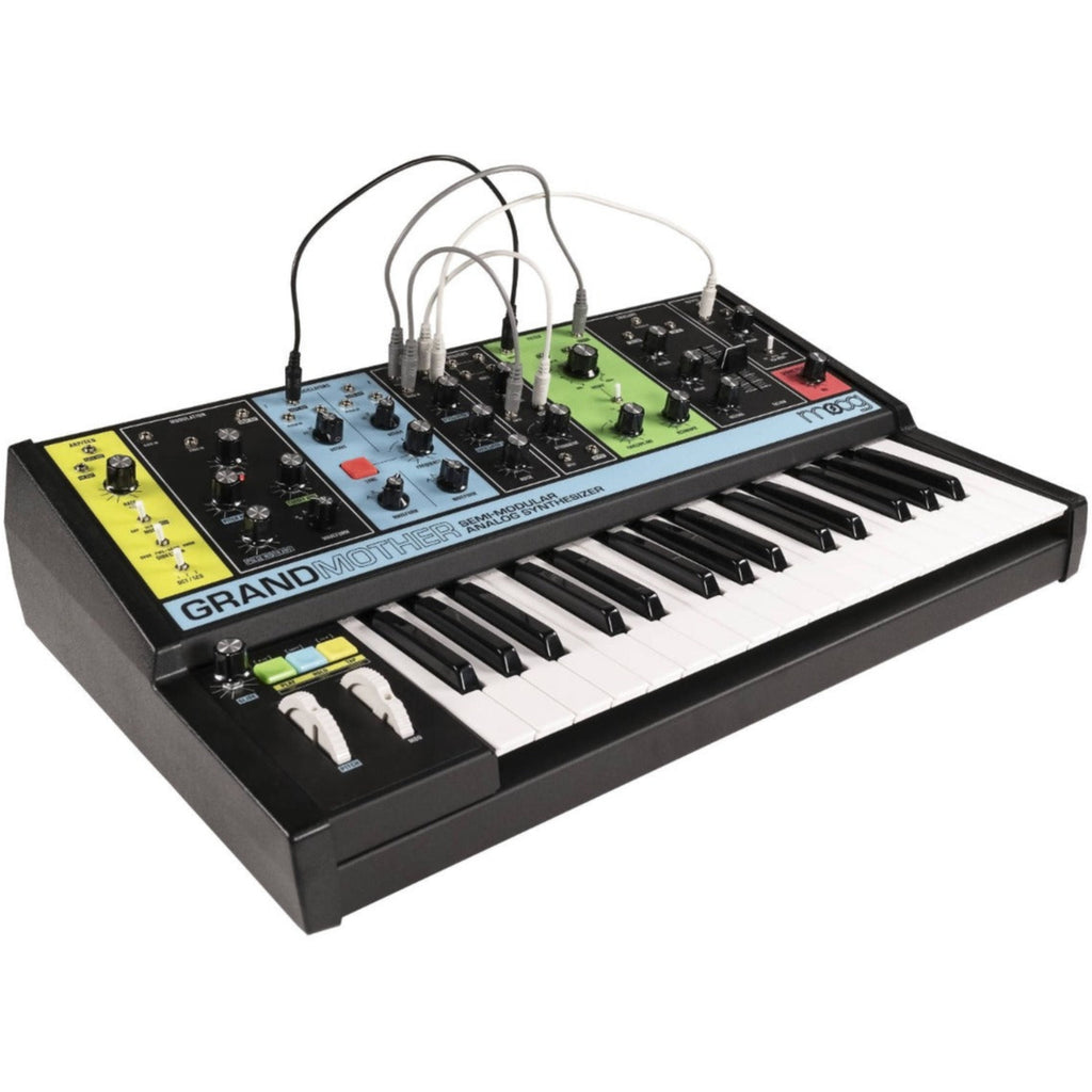 Moog Grandmother synthesizer with vintage design, featuring knobs, patch cables, and keyboard for analog sound creation.