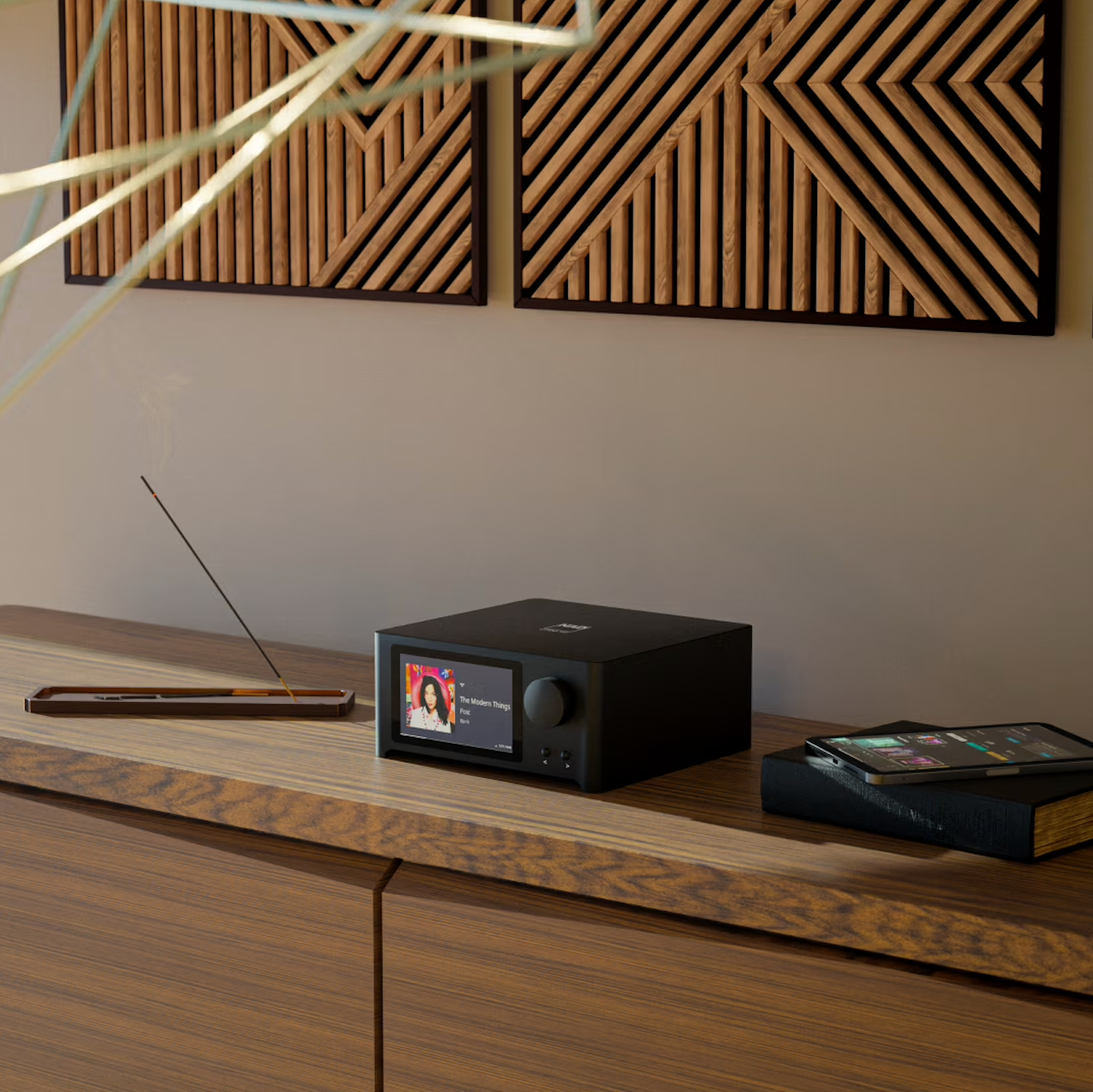 NAD C 700 V2 music streamer with sleek black design, front display, and control buttons for high-quality wireless music streaming.