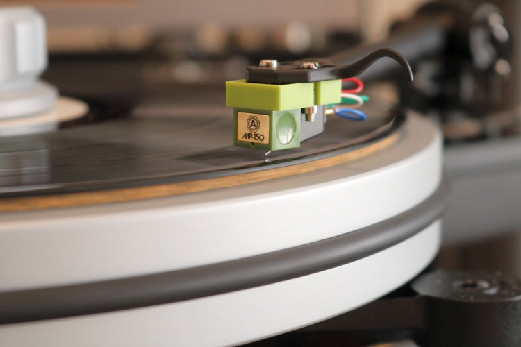 Nagaoka MP-150 turntable cartridge mounted on a record player, showcasing its stylus and body design.