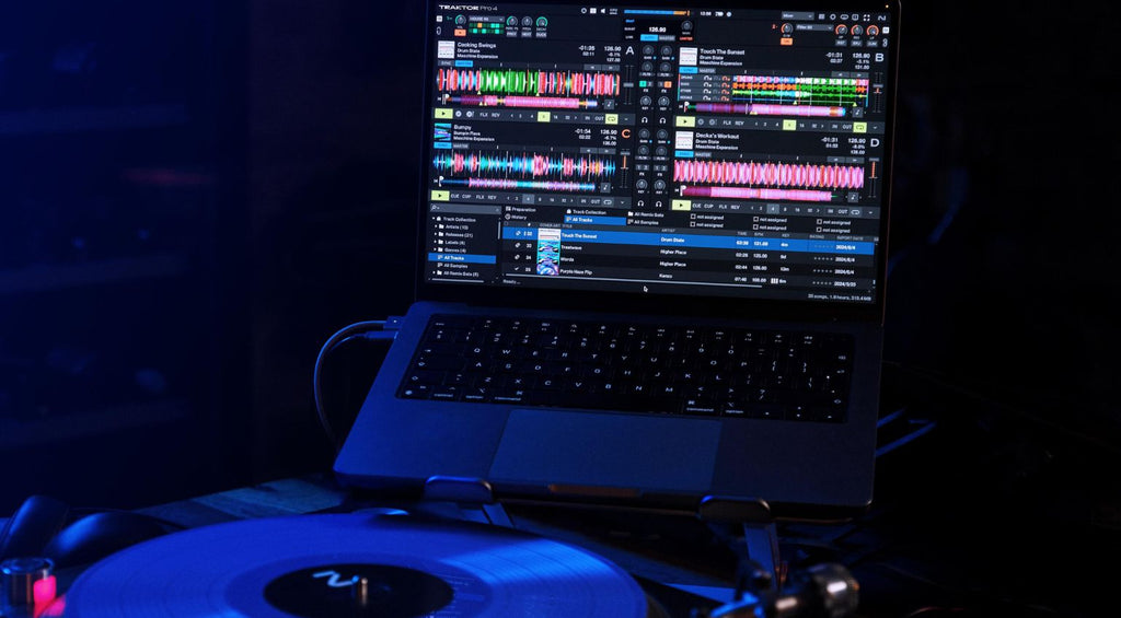 Native Instruments Traktor Pro 4 DJ software interface displayed on a computer screen, featuring waveforms and control panels.