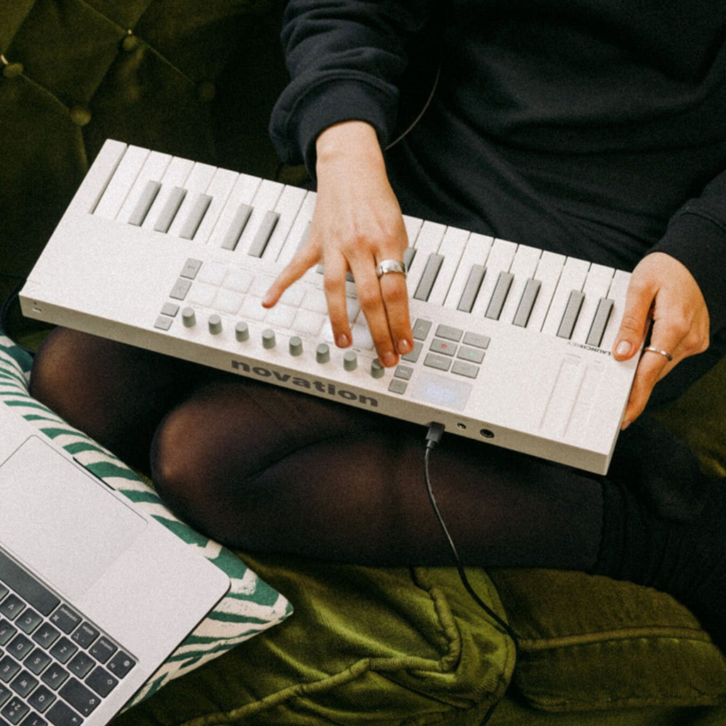 Novation Launchkey Mini 37 MK4 MIDI keyboard, in white, lifestyle setting