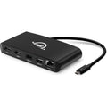 OWC Thunderbolt Mini Dock connected to a laptop, showing multiple ports for USB, HDMI, and power, compact and versatile docking station.