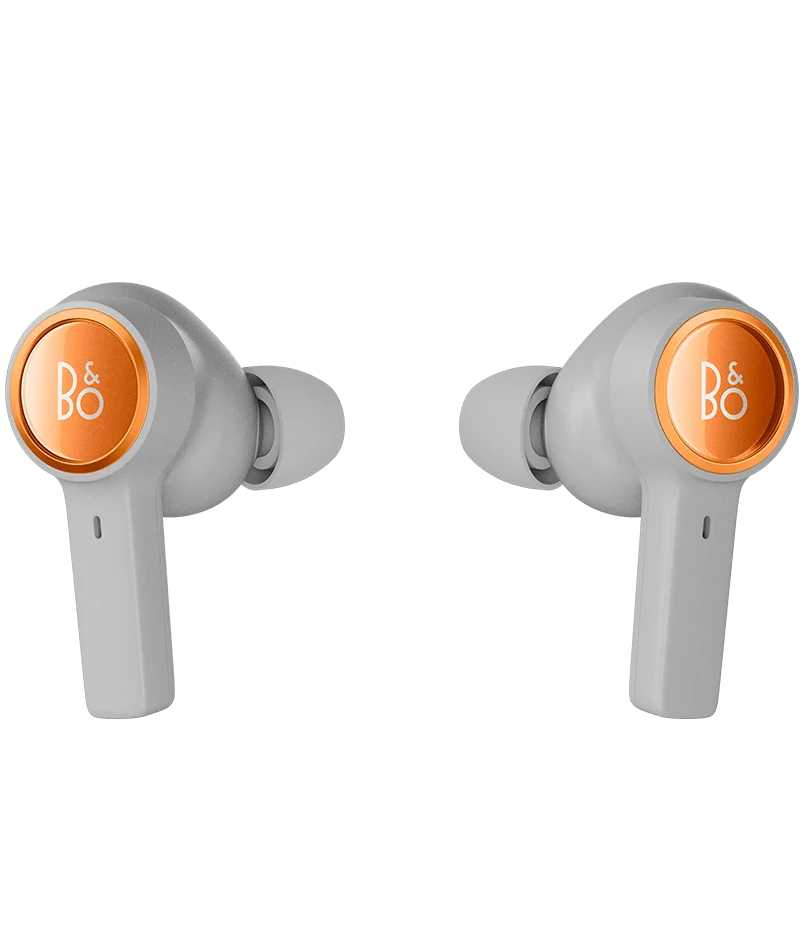 Bang & Olufsen Beoplay Eleven wireless in-ear headphones with copper-tone finish, shown in a front perspective.