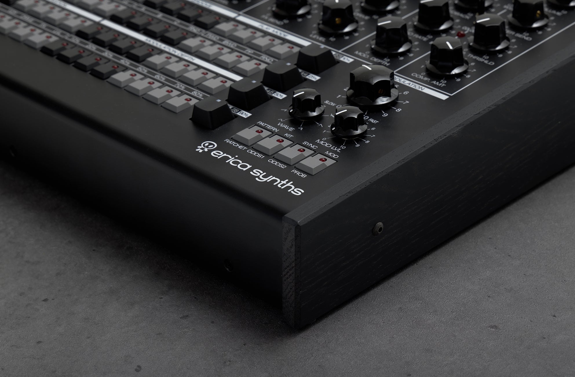 Black Erica Synths Perkons HD-01 drum machine and sampler with knobs, pads, and display, designed for electronic music production.