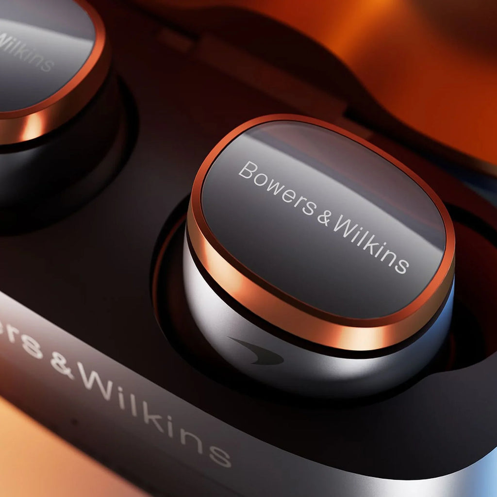 Bowers & Wilkins Pi8 wireless in-ear headphones with sleek design and matte black finish, shown with McLaren branding details.