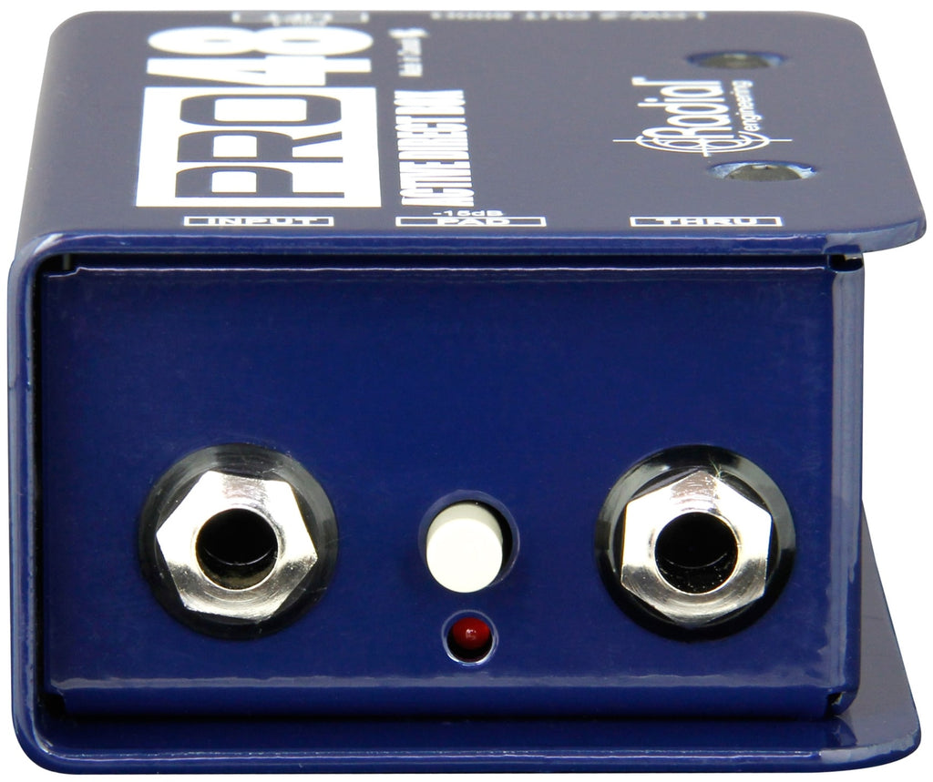 Radial Engineering Pro48 DI box with input and output jacks, compact black metal enclosure, professional audio equipment for live or studio use.