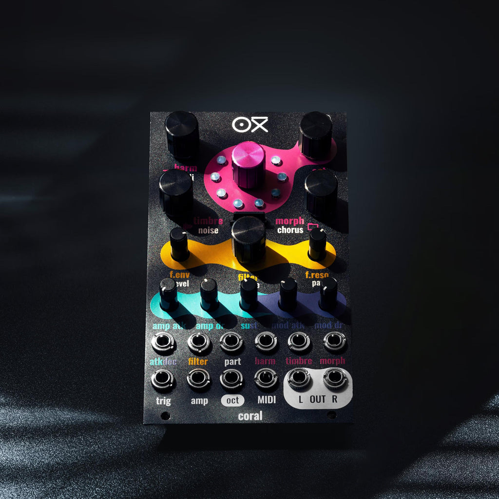 OXI Instruments Coral semi-modular synthesizer with colorful knobs and patch cables, showcasing its versatile electronic music interface.