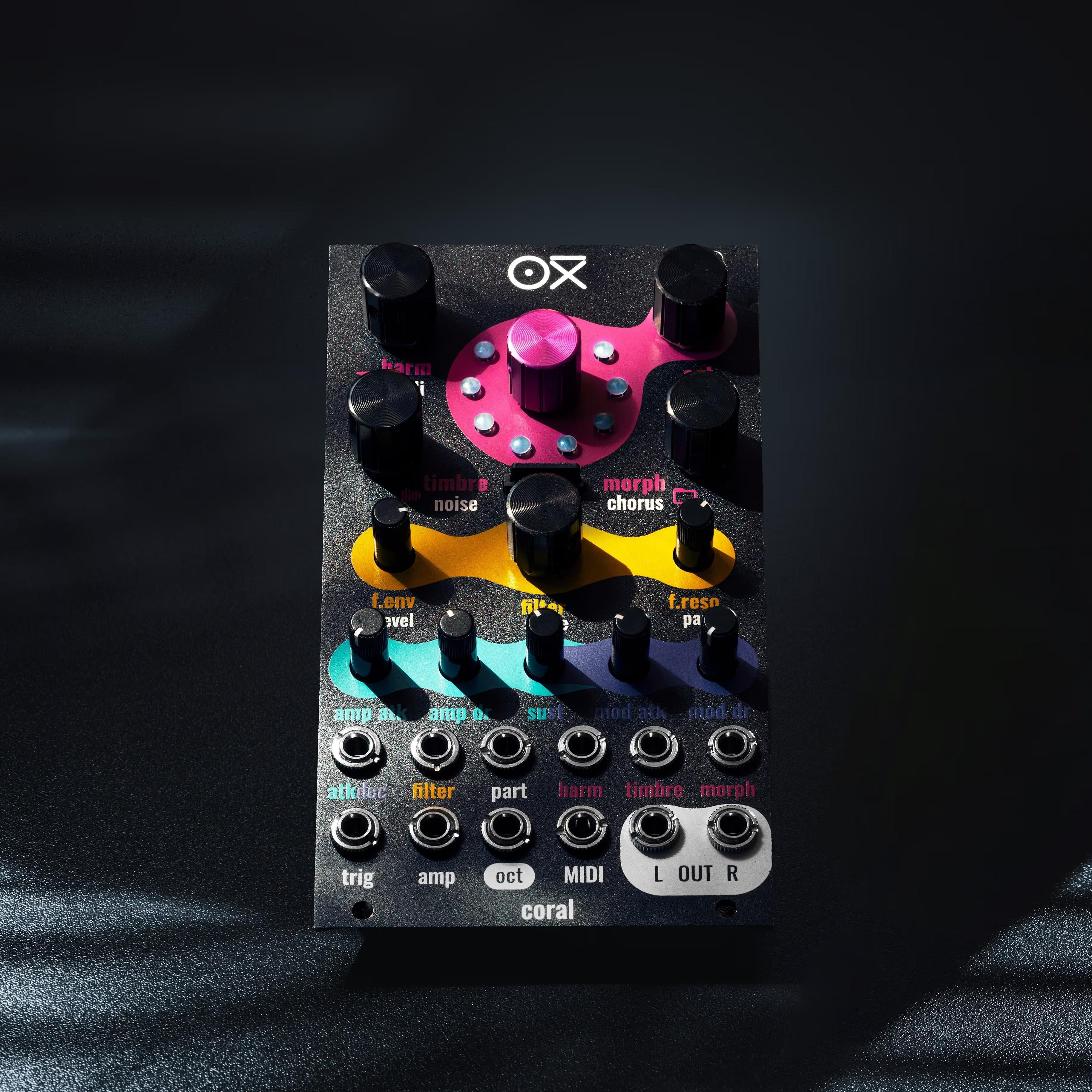 OXI Instruments Coral semi-modular synthesizer with colorful knobs and patch cables, showcasing its versatile electronic music interface.