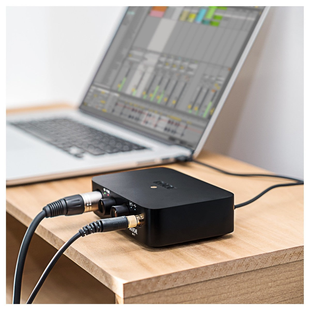Rode AI-1 audio interface with sleek design, multiple input ports, and professional-grade audio equipment for recording and streaming.