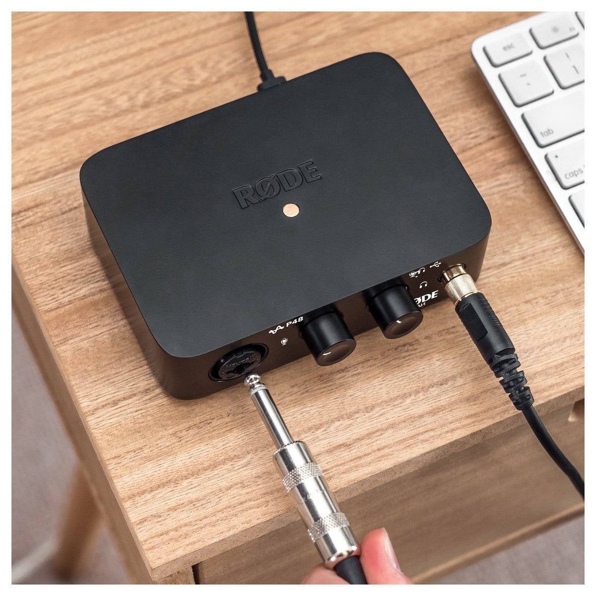 Rode AI-1 audio interface with sleek design, featuring input and output ports for professional recording and streaming.