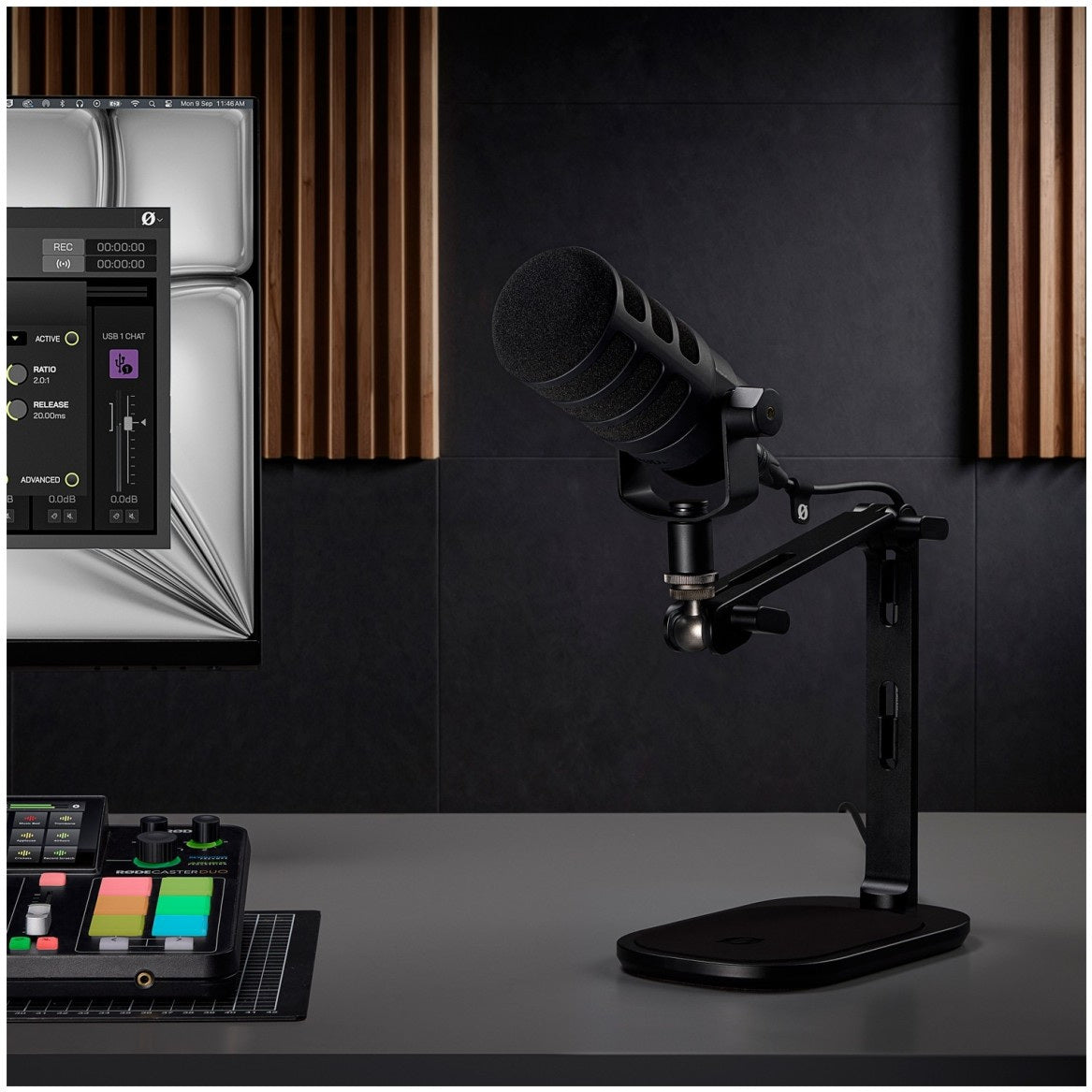 Rode DS3 black desktop studio arm holding a Rode PodMic on a studio desk