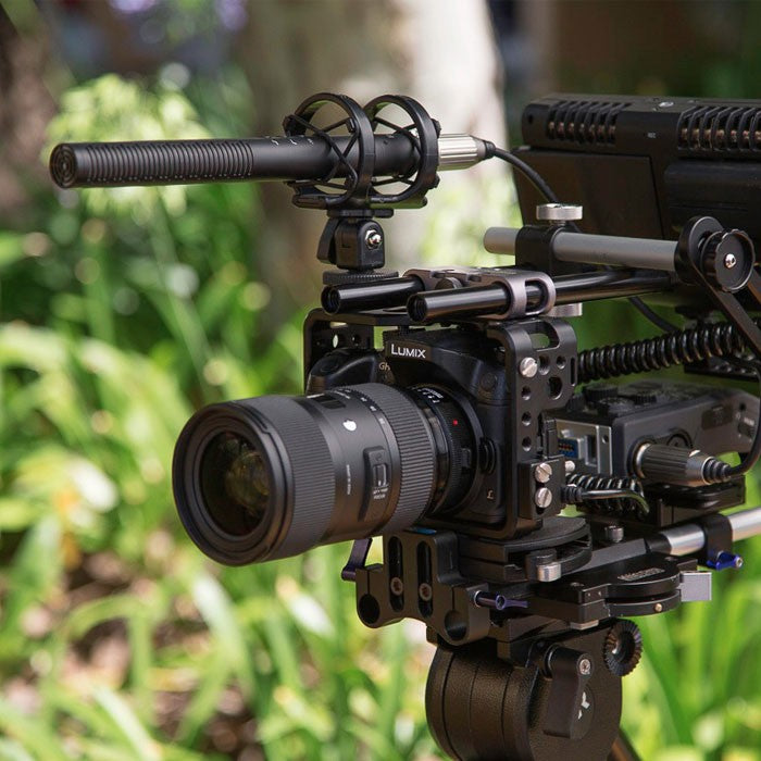Rode NTG4 shotgun microphone mounted on a boom pole, professional audio recording equipment for clear sound capture.