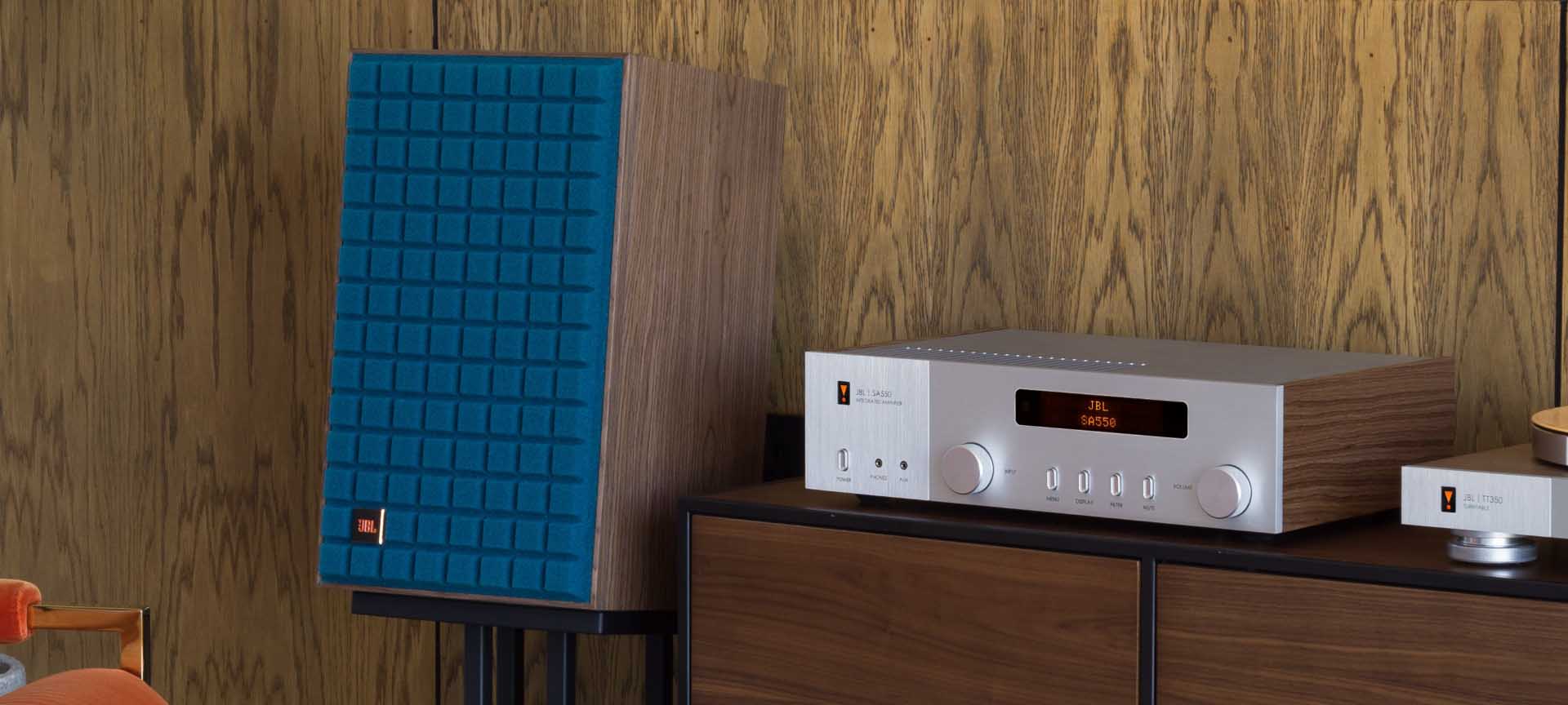 JBL SA550 Classic stereo amplifier on desktop, featuring sleek design and control knobs for high-quality audio performance.