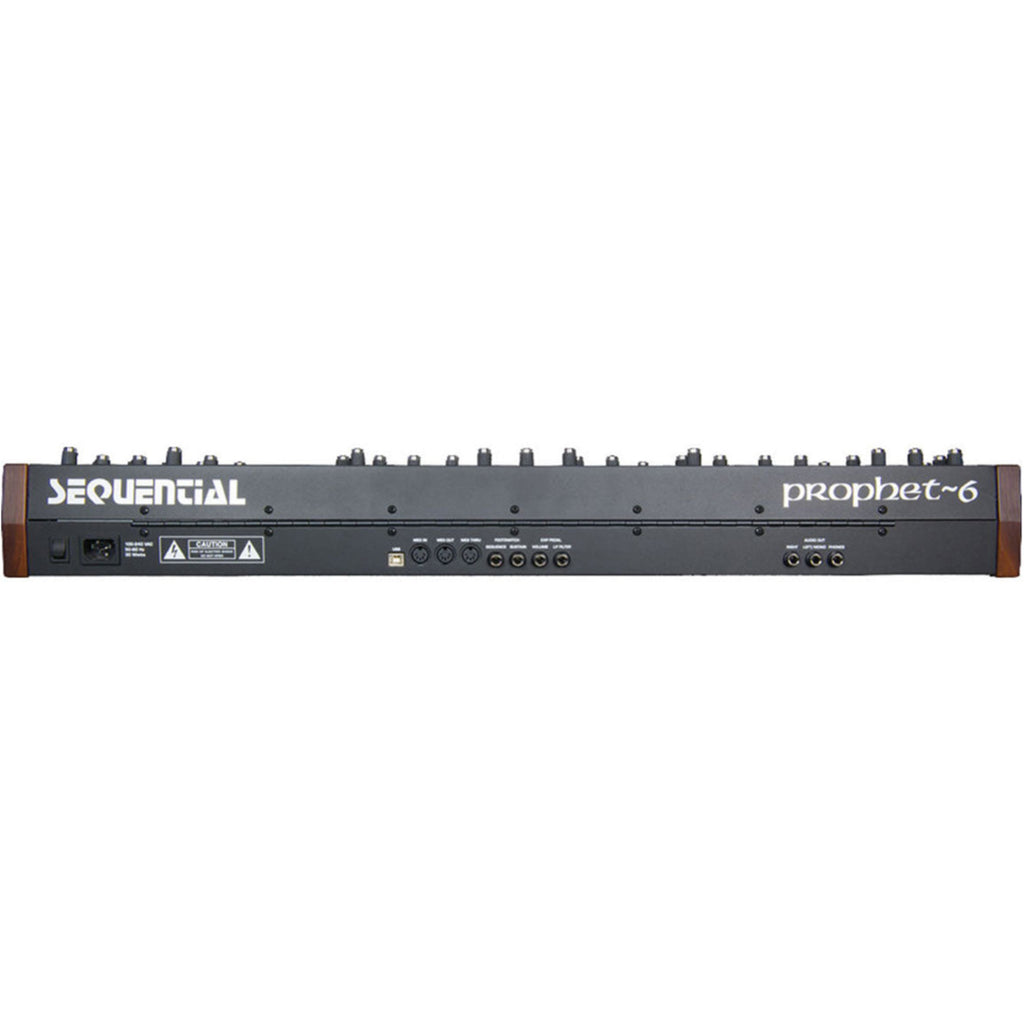 Sequential Prophet-6 synthesizer with multiple knobs and keys, showcasing its professional analog sound hardware.