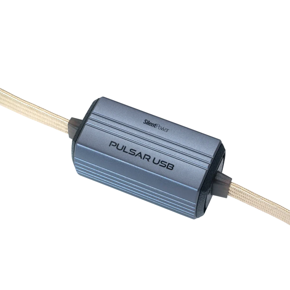 SilentPower Pulsar USB noise filter and conditioner connected to a computer, reducing electronic interference for clearer signals