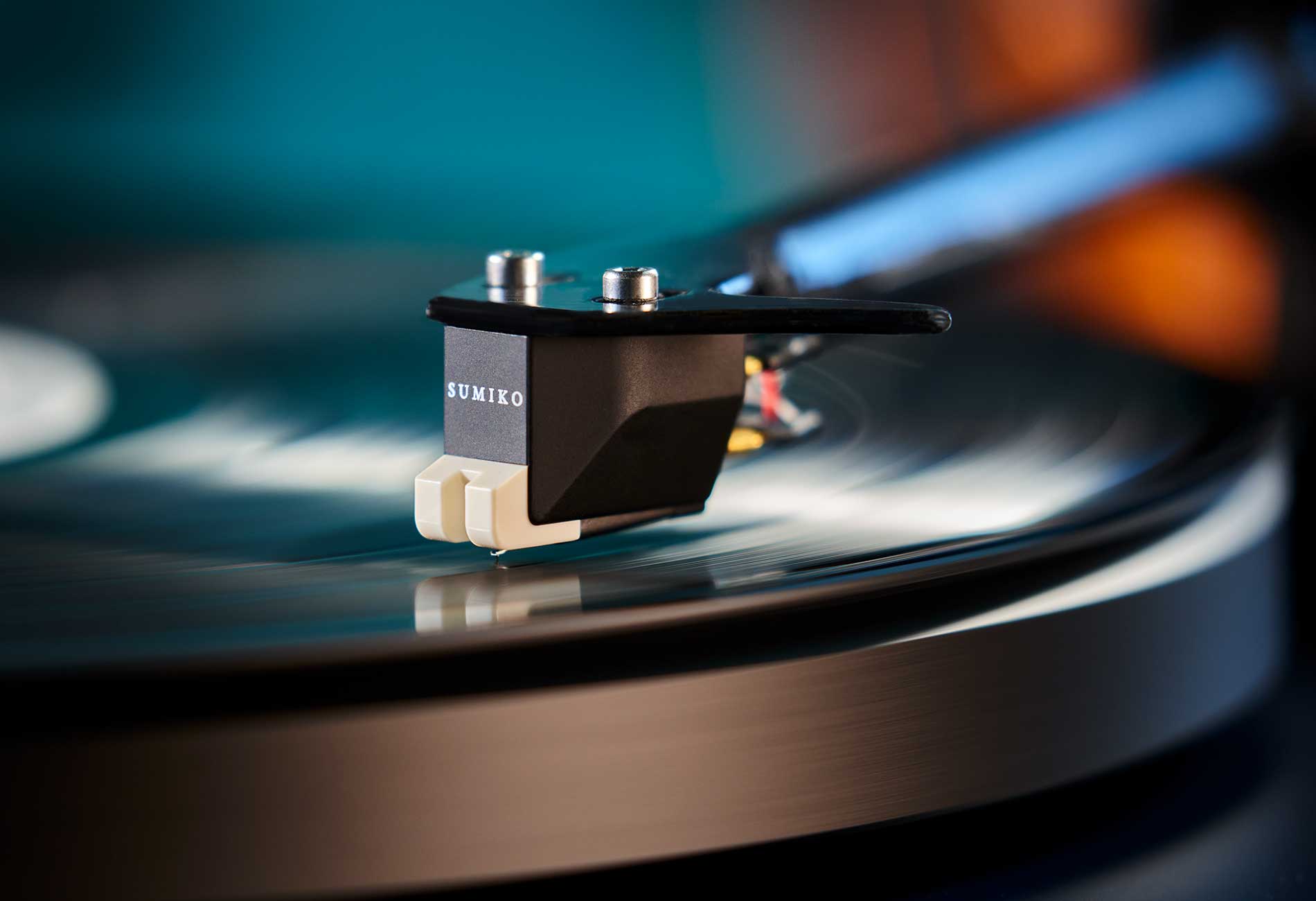 Sumiko Rainier MM phono cartridge mounted on a turntable, showcasing its design and stylus for vinyl playback.