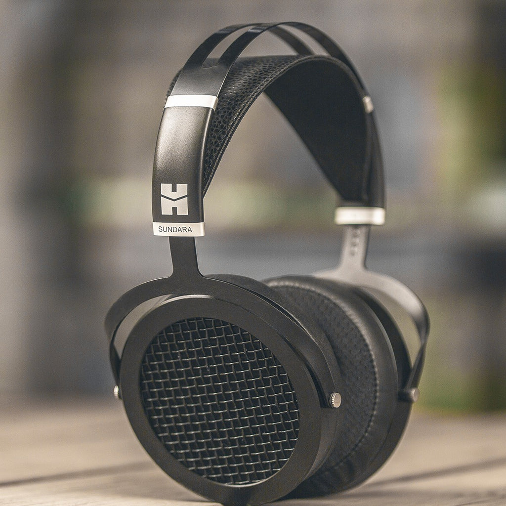 HiFiMAN Sundara wired headphones with open-back design and over-ear cups, showcasing sleek black ear cups and headband.