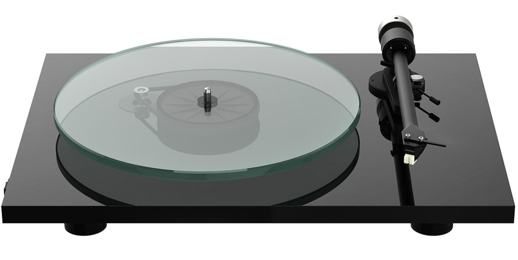 Pro-Ject T2 W turntable with wood finish and sleek design, featuring tonearm and platter for high-quality vinyl playback.