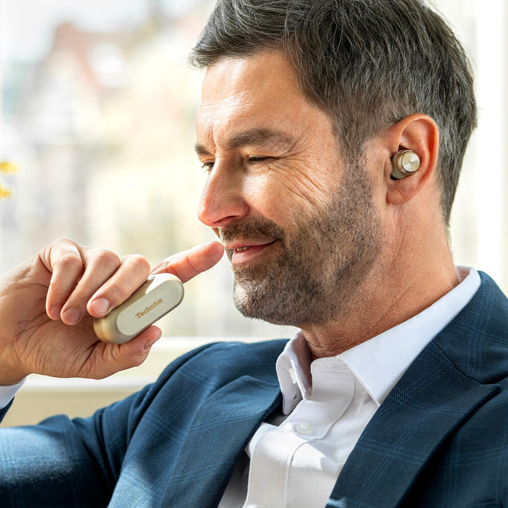 Technics EAH-AZ100 true wireless earbuds, in gold, with charging case