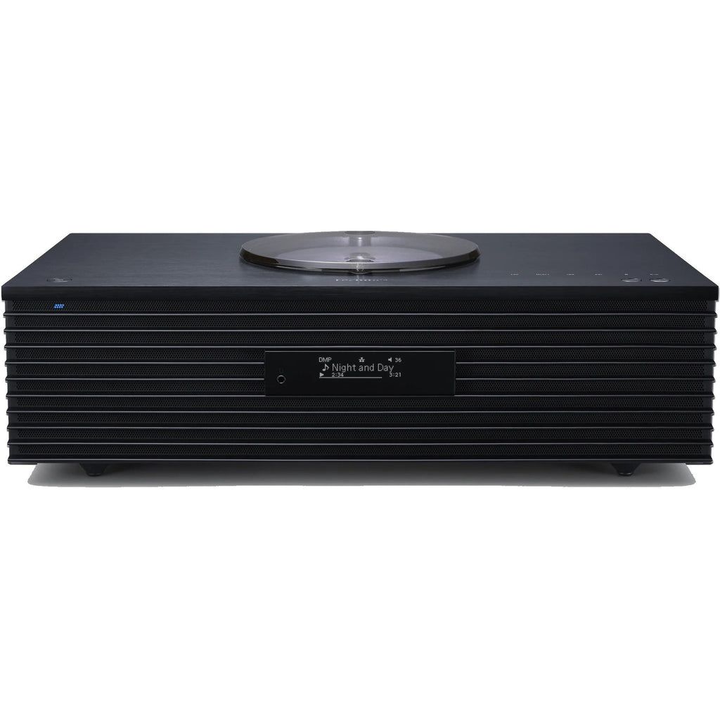 Technics SC-C70MK2 CD player with sleek design, digital display, and control buttons on top, in a modern home audio setup.