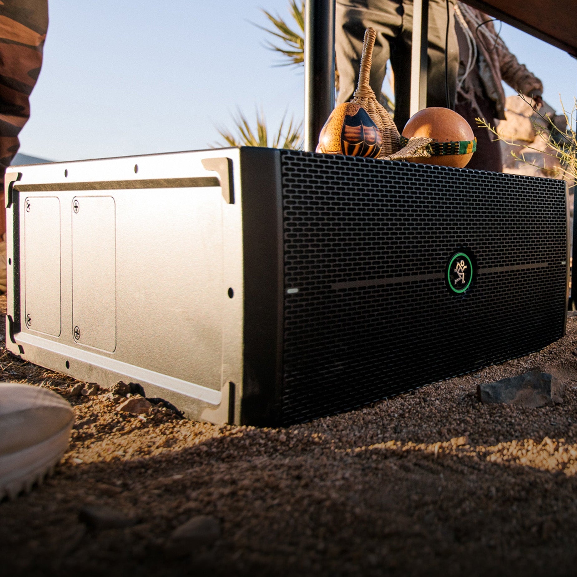 Mackie ThumpSub GO compact subwoofer with integrated handle and controls, designed for portable bass amplification.