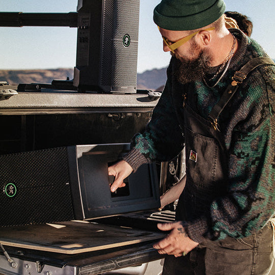 Mackie ThumpSub GO portable subwoofer with rugged design and control panel, ideal for live sound and music setups.